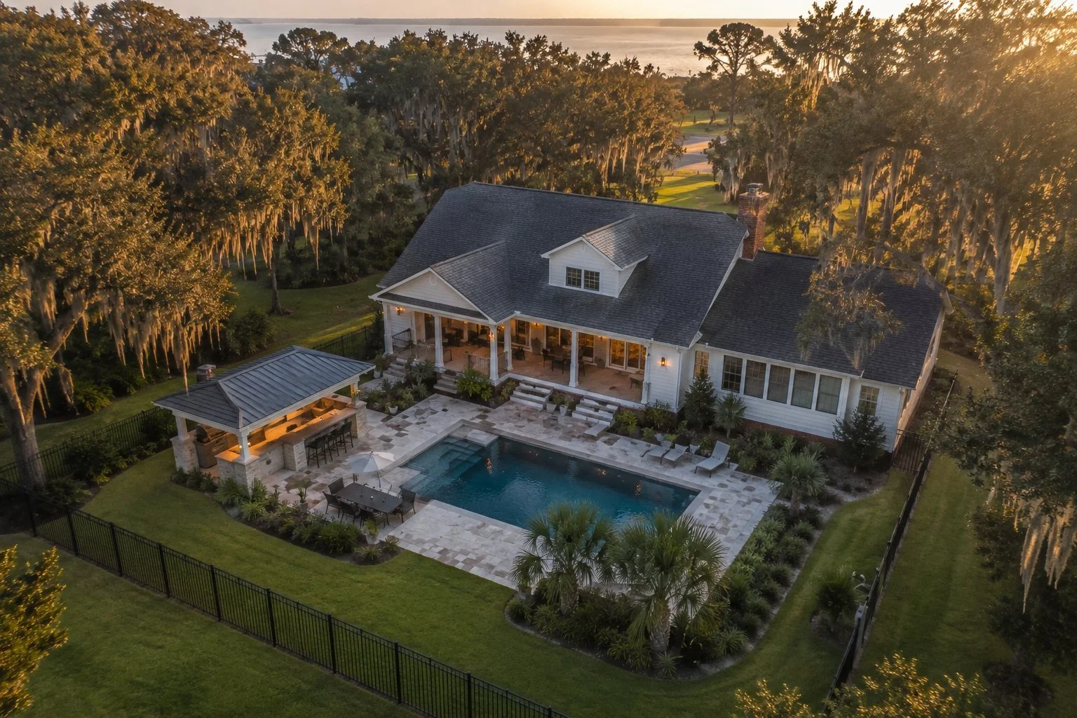 Outdoor kitchen pavilion and pool yard built by Outdoor Solutions in Long Beach, Mississippi