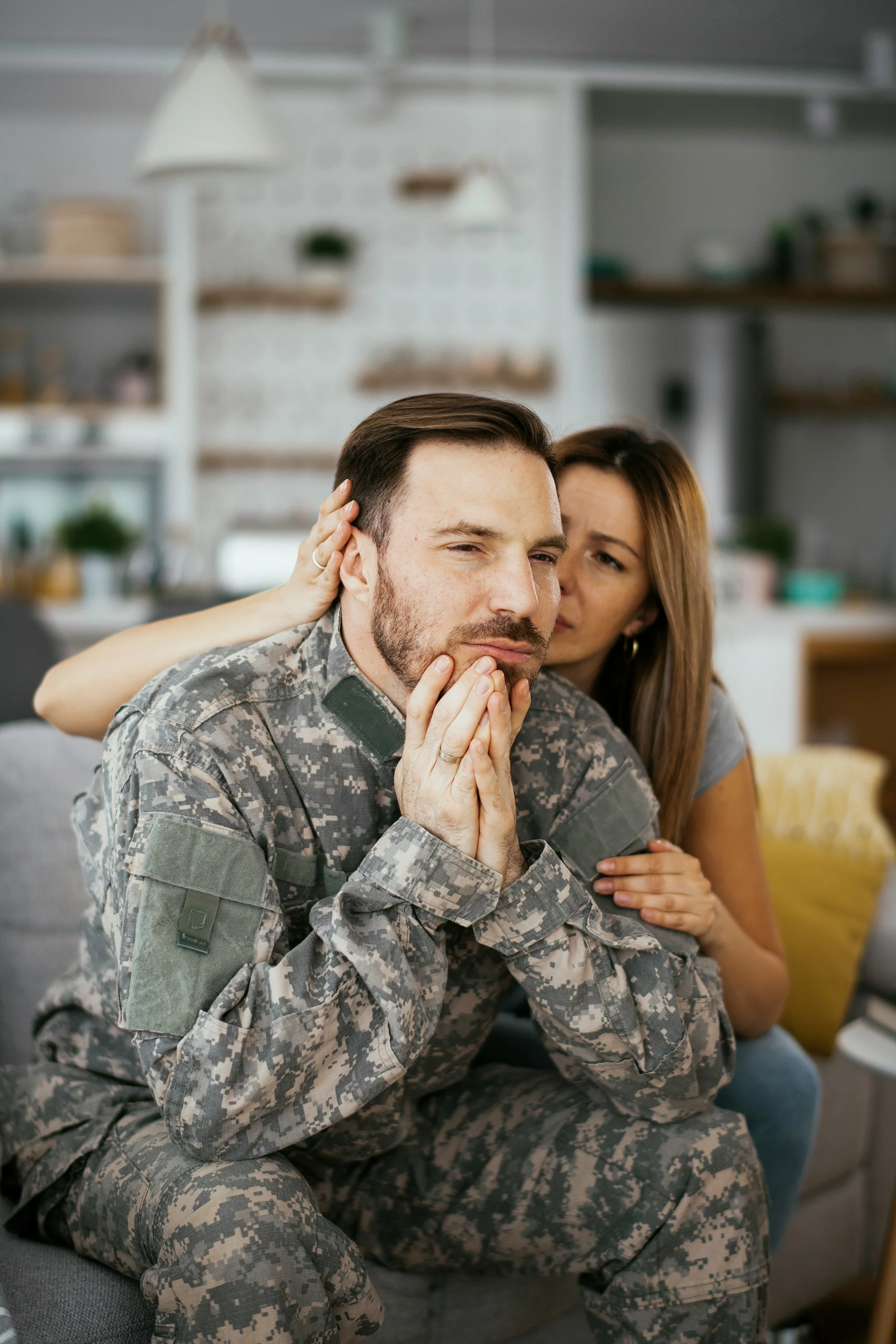 Veteran in uniform sitting with his partner