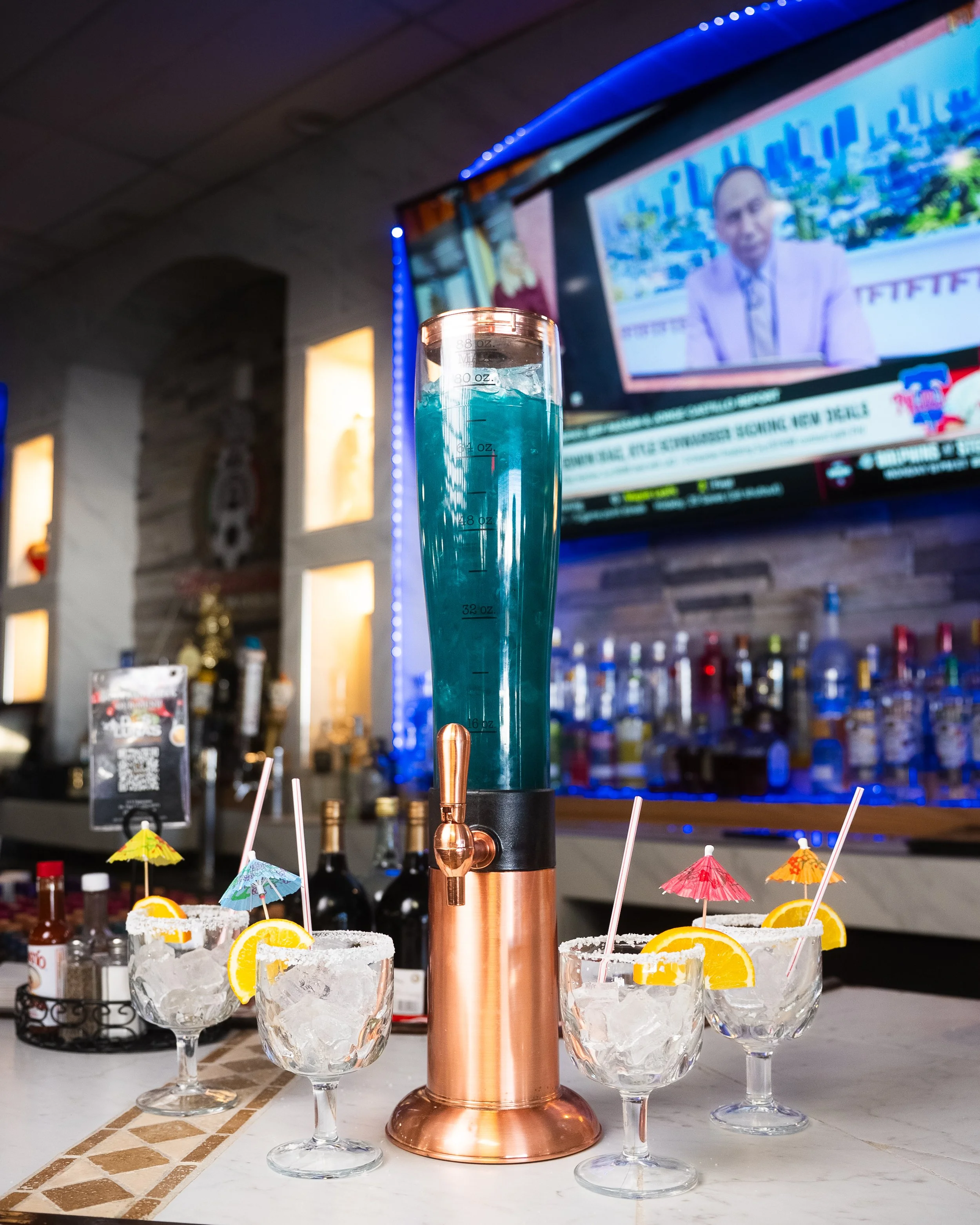 Tower drink with margarita glasses at the bar