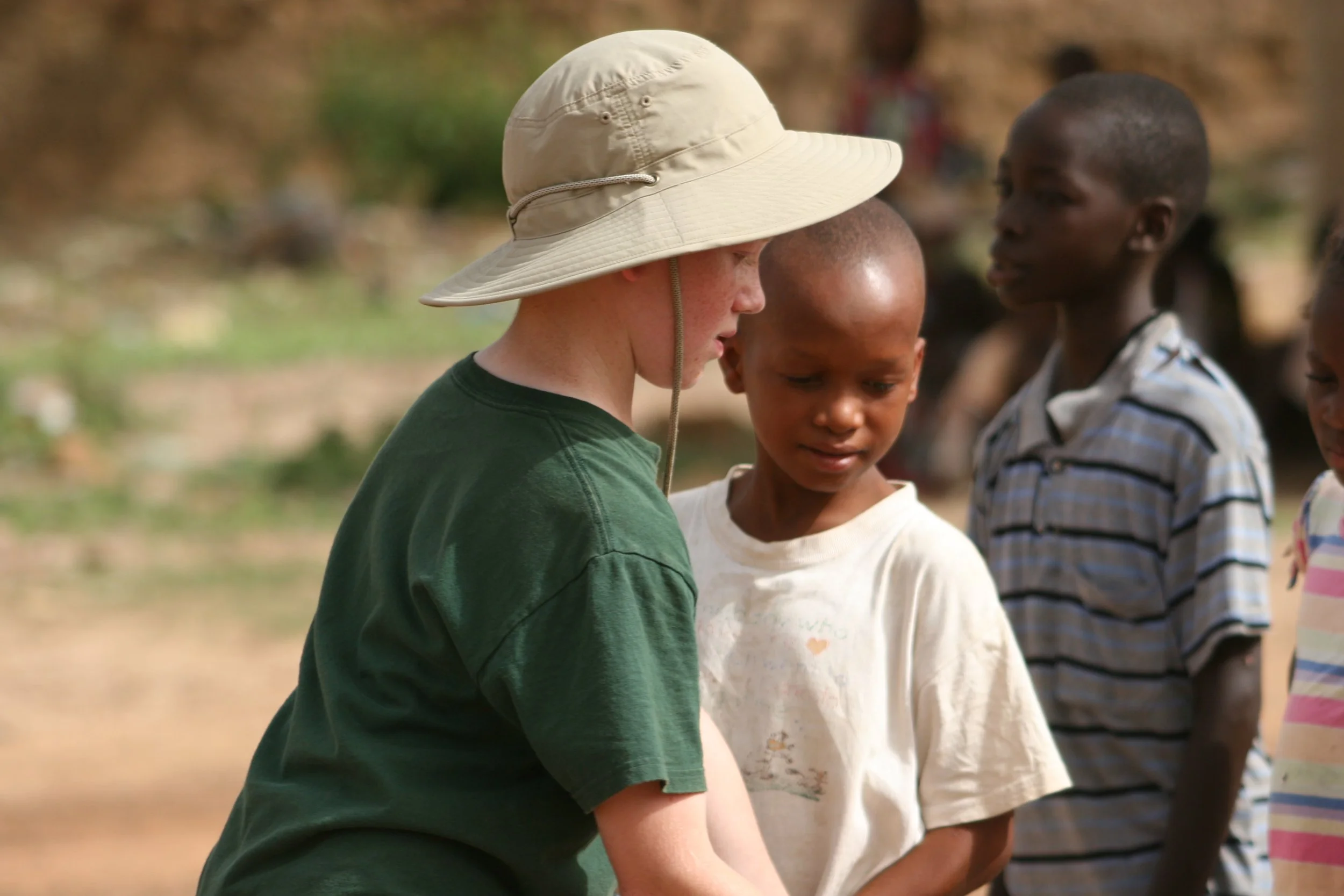 Two young people standing together during tennis activities in Mali