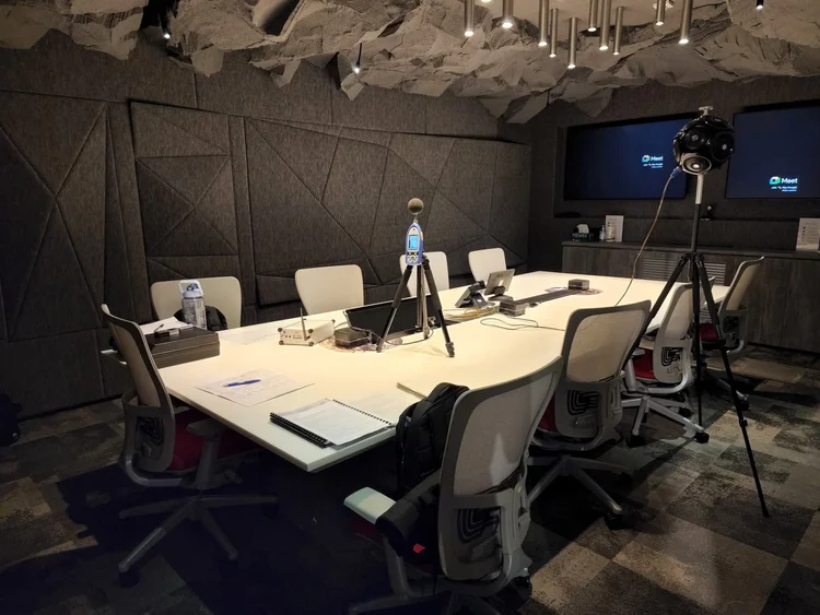 Sound level meter and dodecahedron loudspeaker set up for acoustic measurement in an acoustically treated corporate meeting room in Menara Axiata