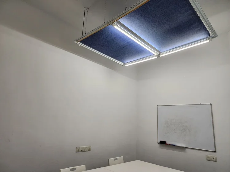 Suspended acoustic baffle panels installed above a classroom ceiling in Japanese language school