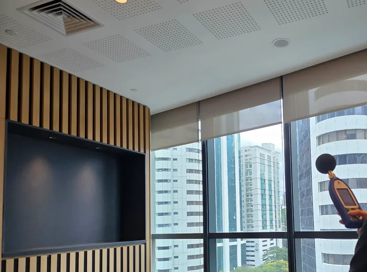 Sound level meter used near the glazed facade of an office at Menara Hap Seng