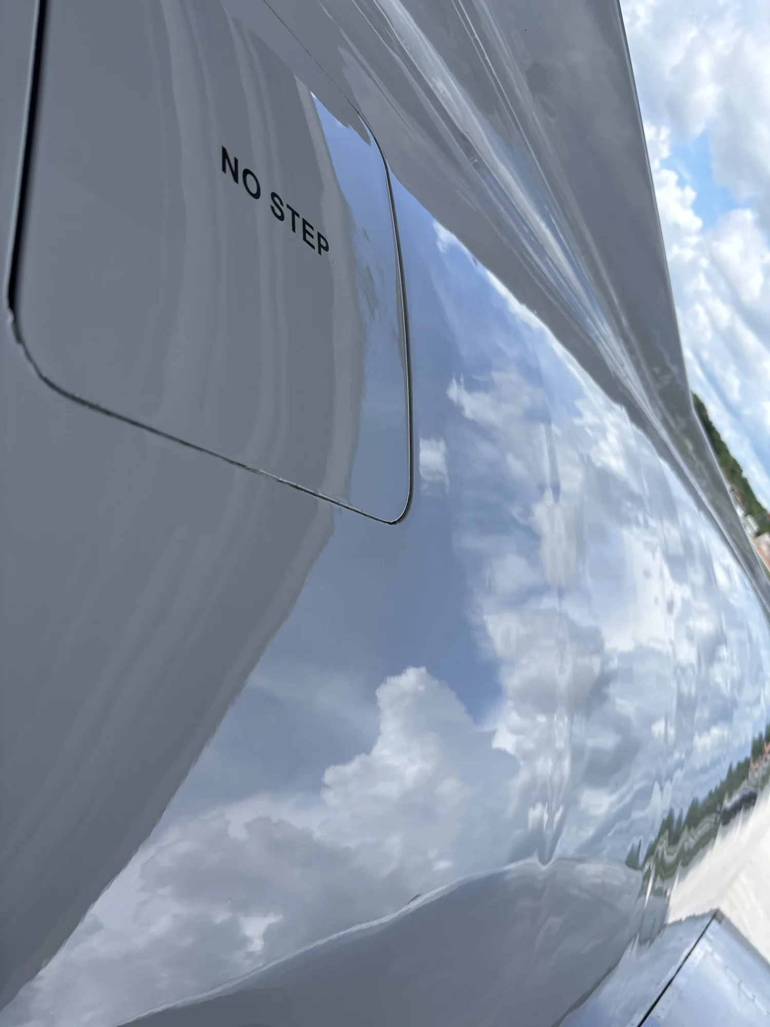 Mirror-finish aircraft skin reflecting the sky