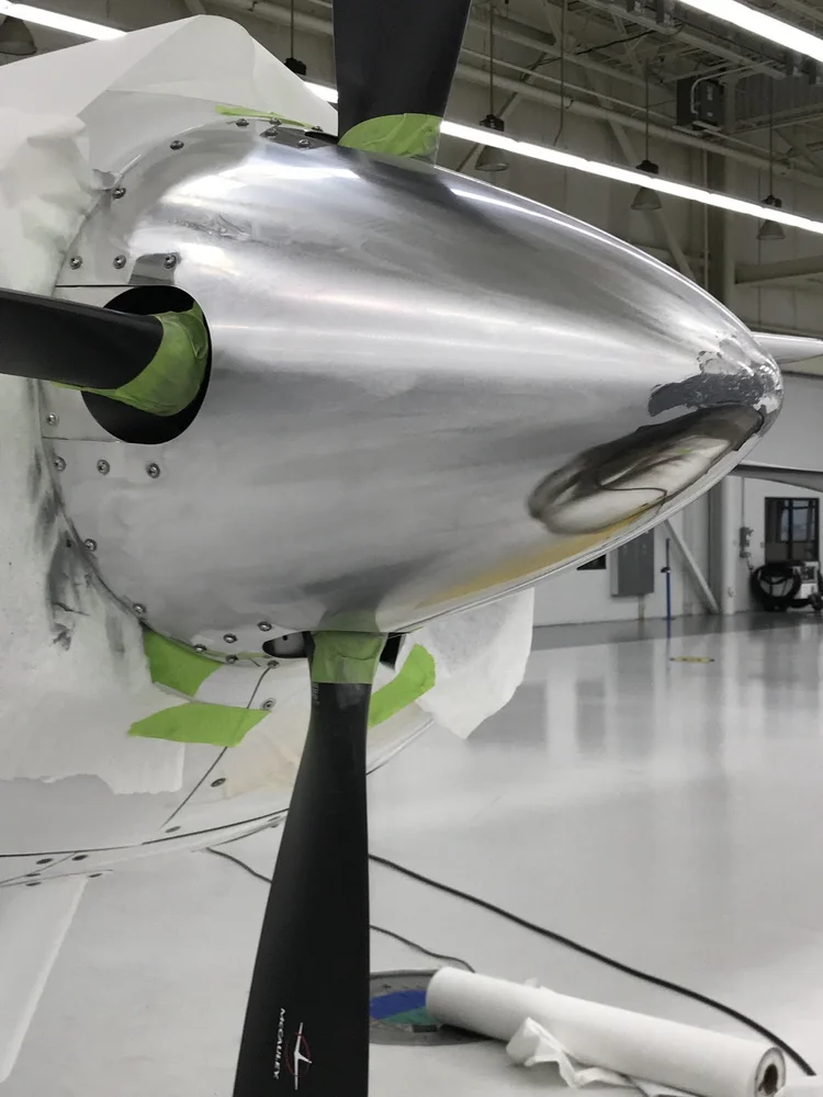 Aircraft propeller spinner before polishing, sanded and dull