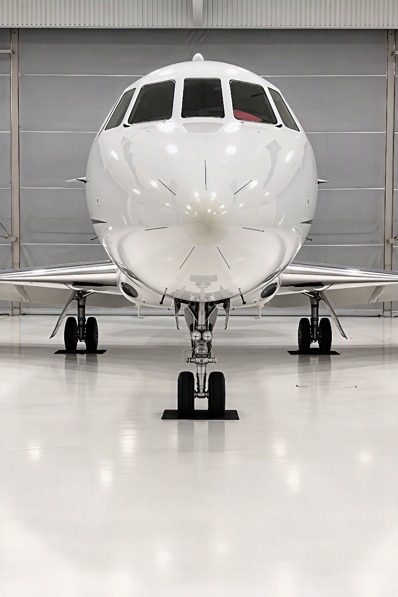 Falcon 2000 nose, polished and parked in a clean hangar