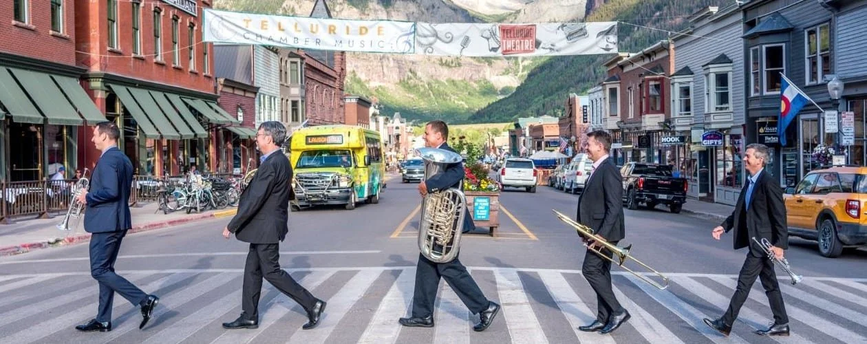 The New York Philharmonic Principal Brass Quintet crossing a Telluride crosswalk on Main Street, Abbey-Road style