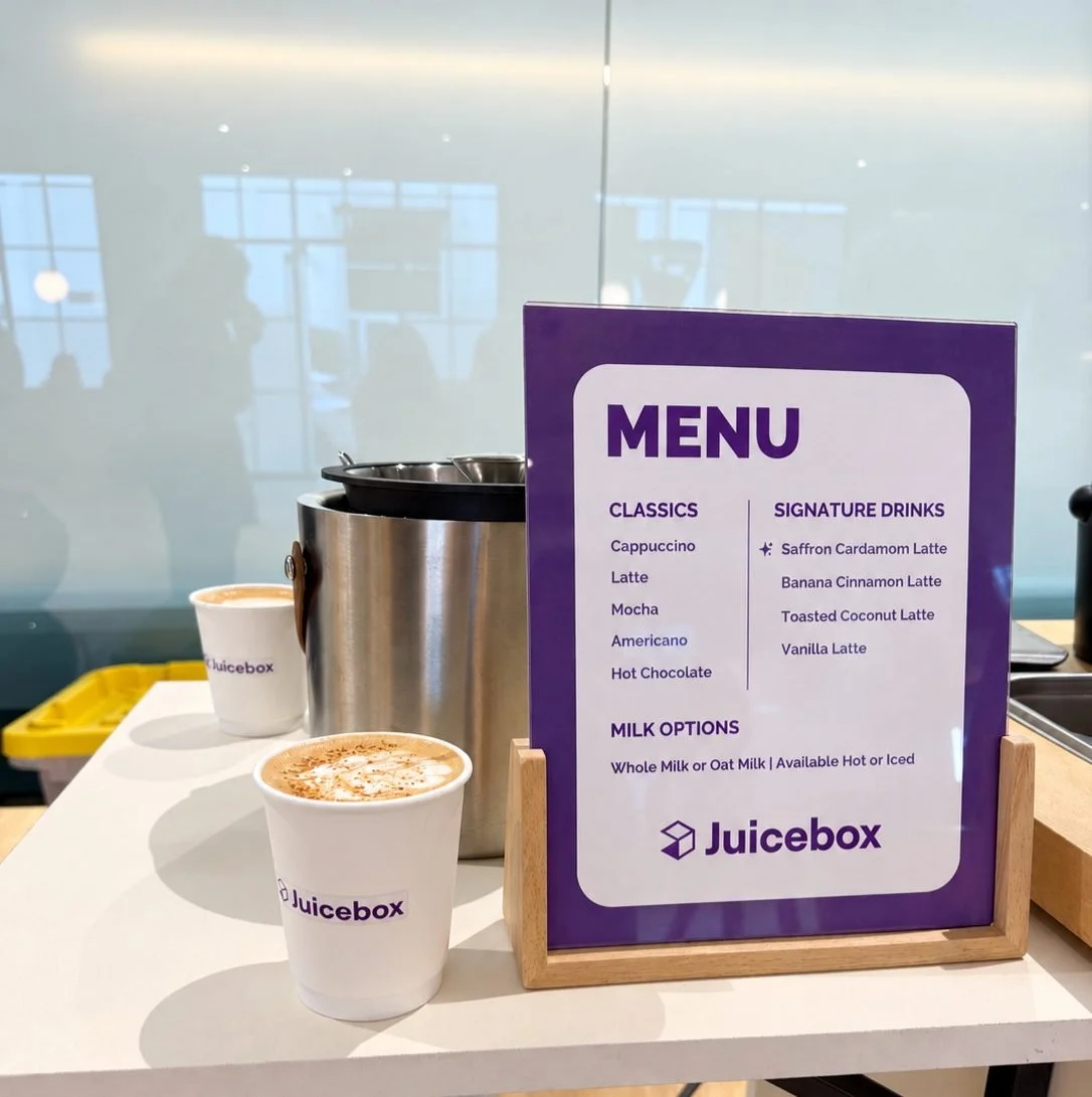 Custom company-branded coffee menu and logo cups on a Goldcrest Brew cart at a Bay Area event