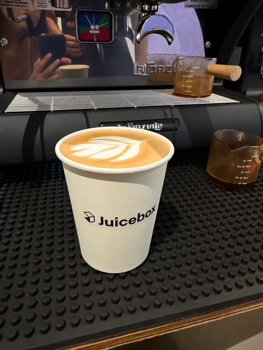 Latte with rosetta latte art made at a Goldcrest Brew coffee cart