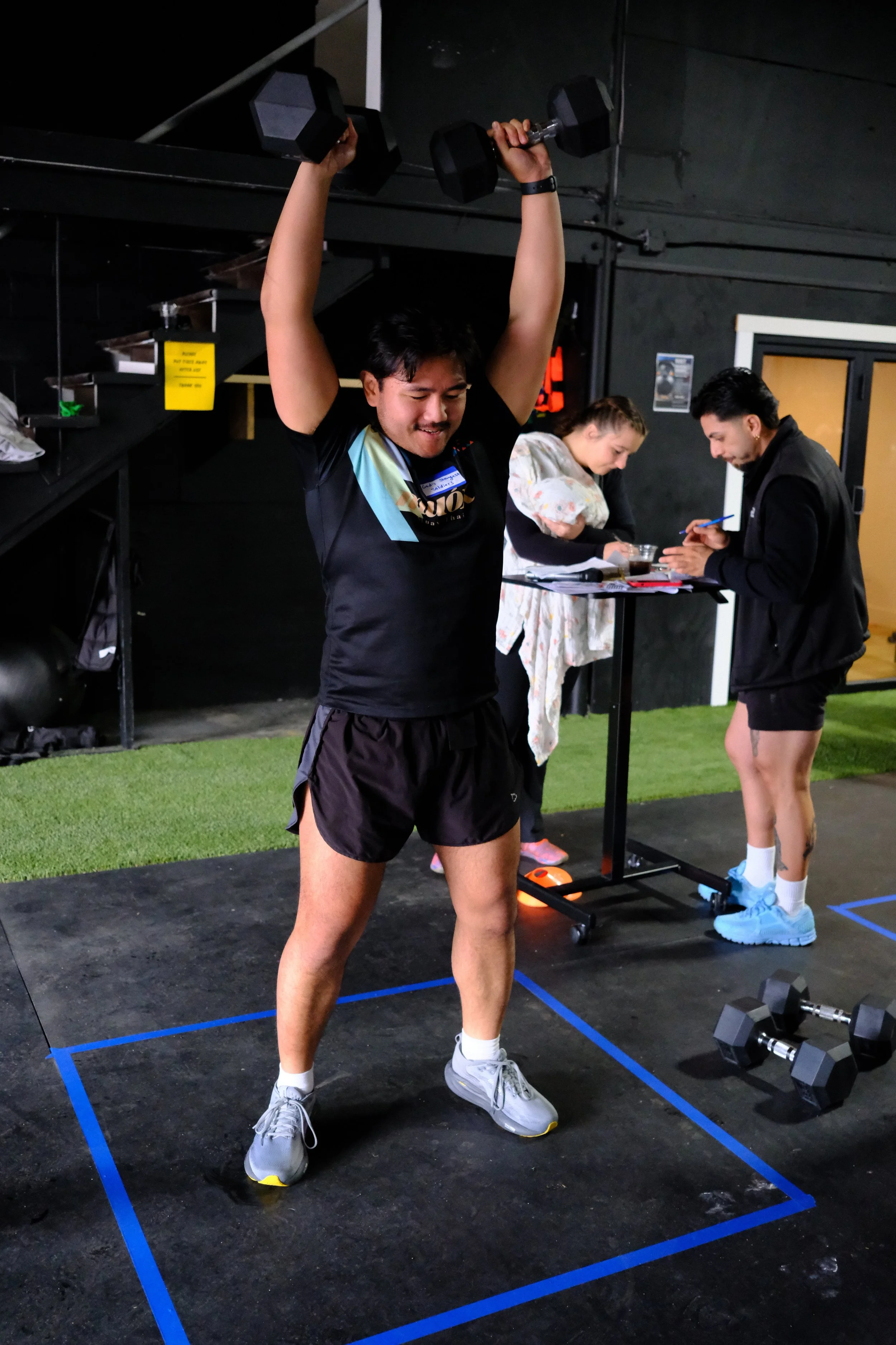 Athlete training with dumbbells at Root Strength Georgetown Seattle