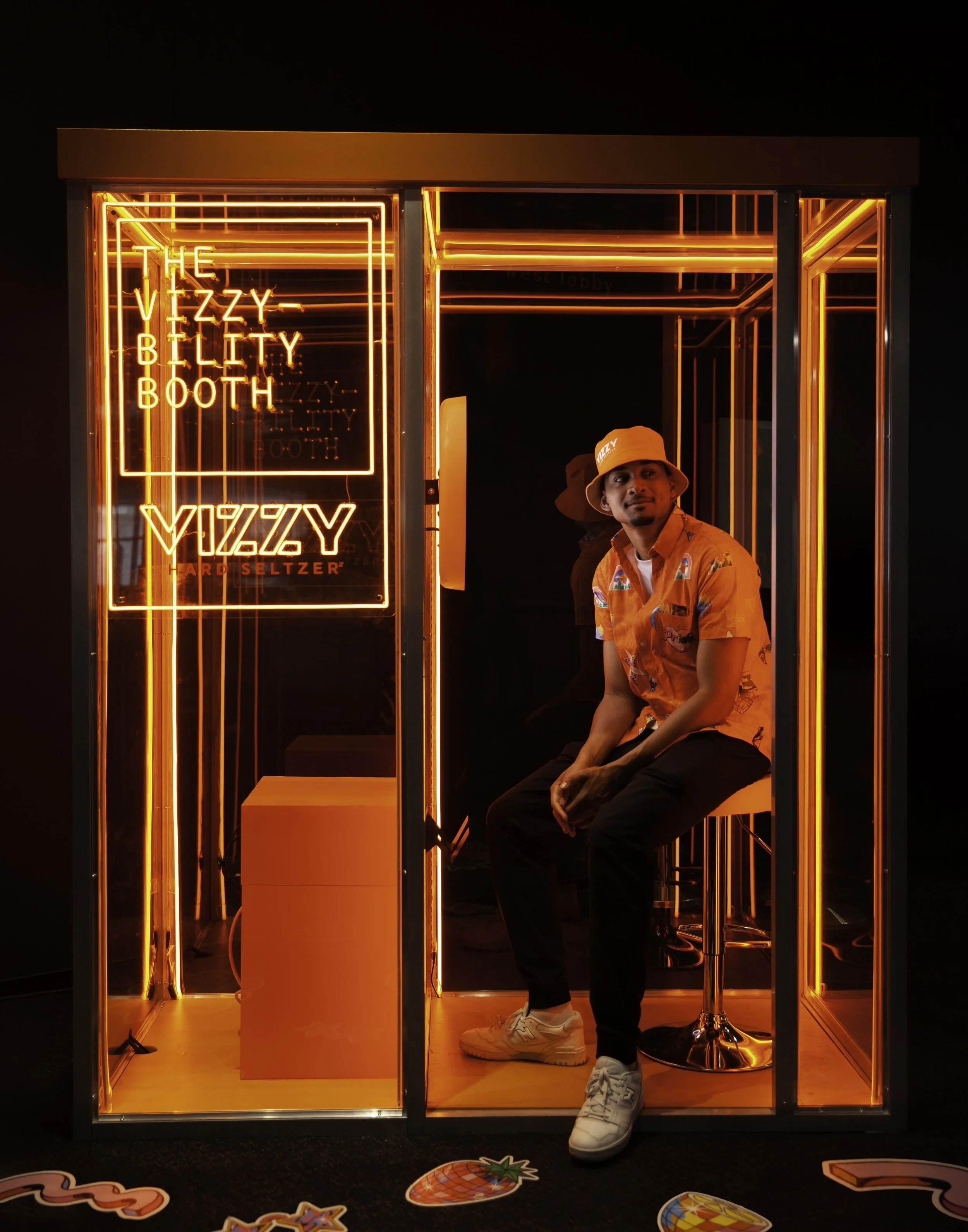 Guest inside a branded enclosed photo booth