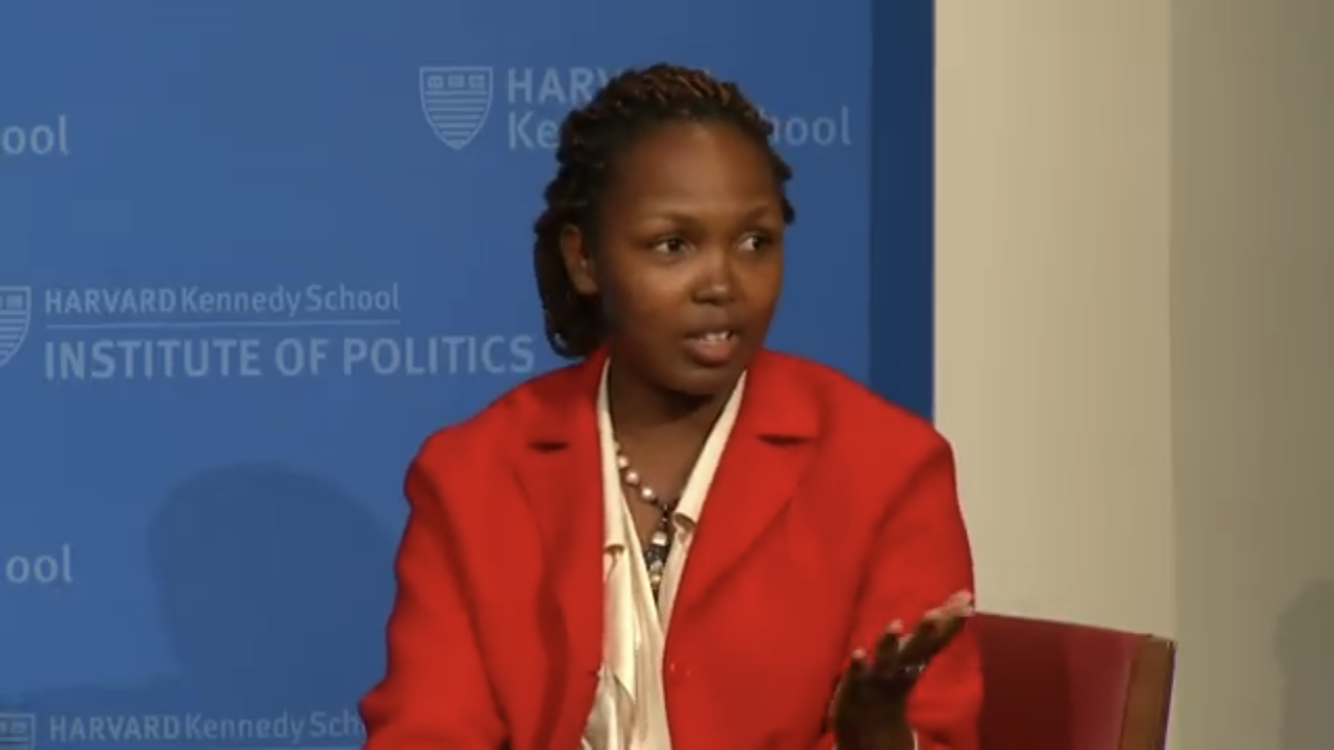 Dydine Umunyana Anderson speaks at the Harvard Kennedy School podium.