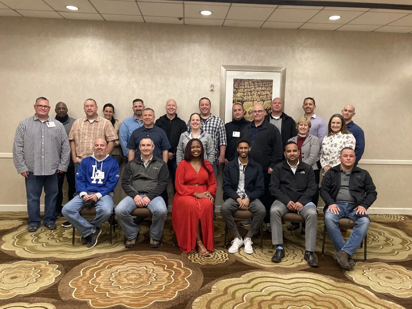 A law enforcement leadership cohort with Dydine after a dialogue session
