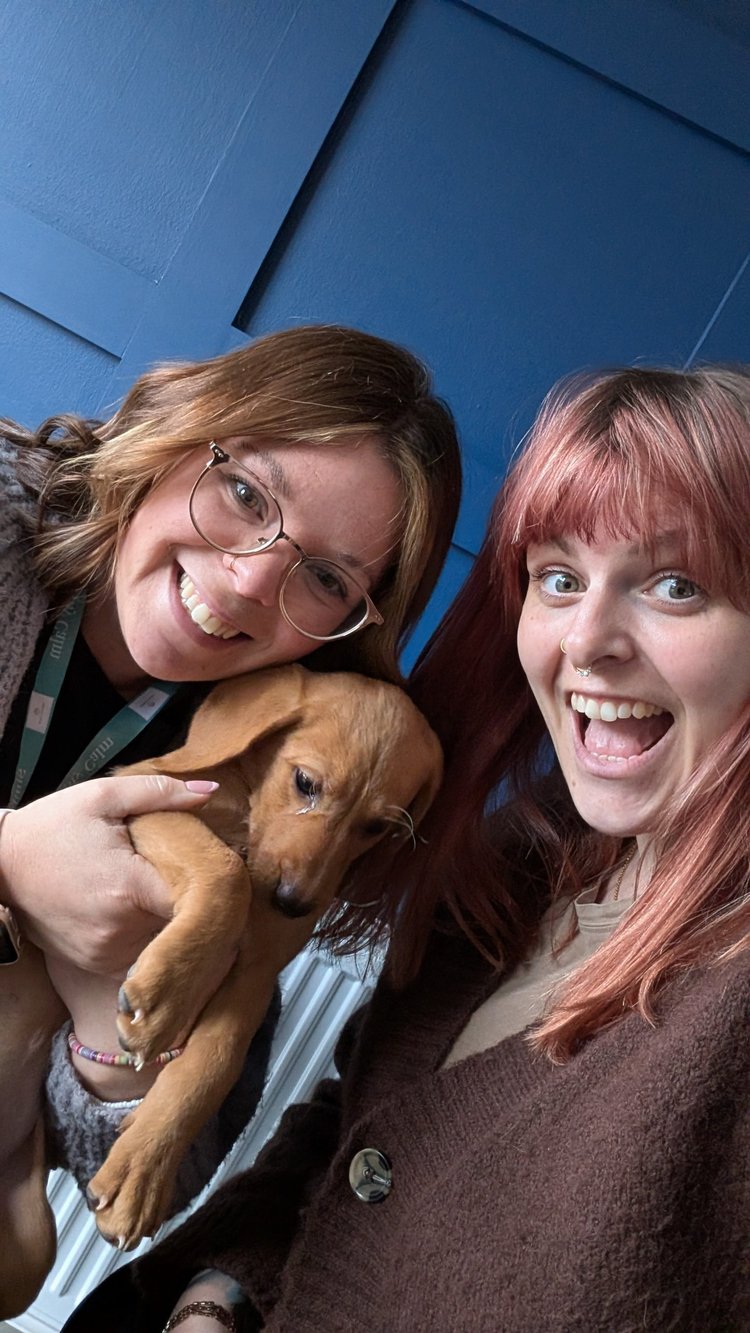 Carmen and Alison with a puppy