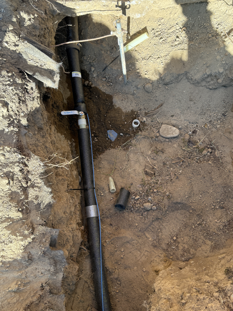 Neptune Plumbing replacing a rusted galvanized main water line with modern PEX piping in Tukwila to improve water quality, flow, and plumbing reliability.
