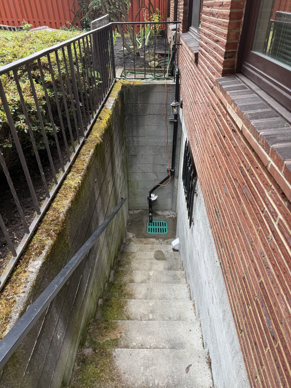 Neptune Plumbing sump pump catch basin installation in Seattle for basement waterproofing, rainwater drainage, and basement flooding prevention