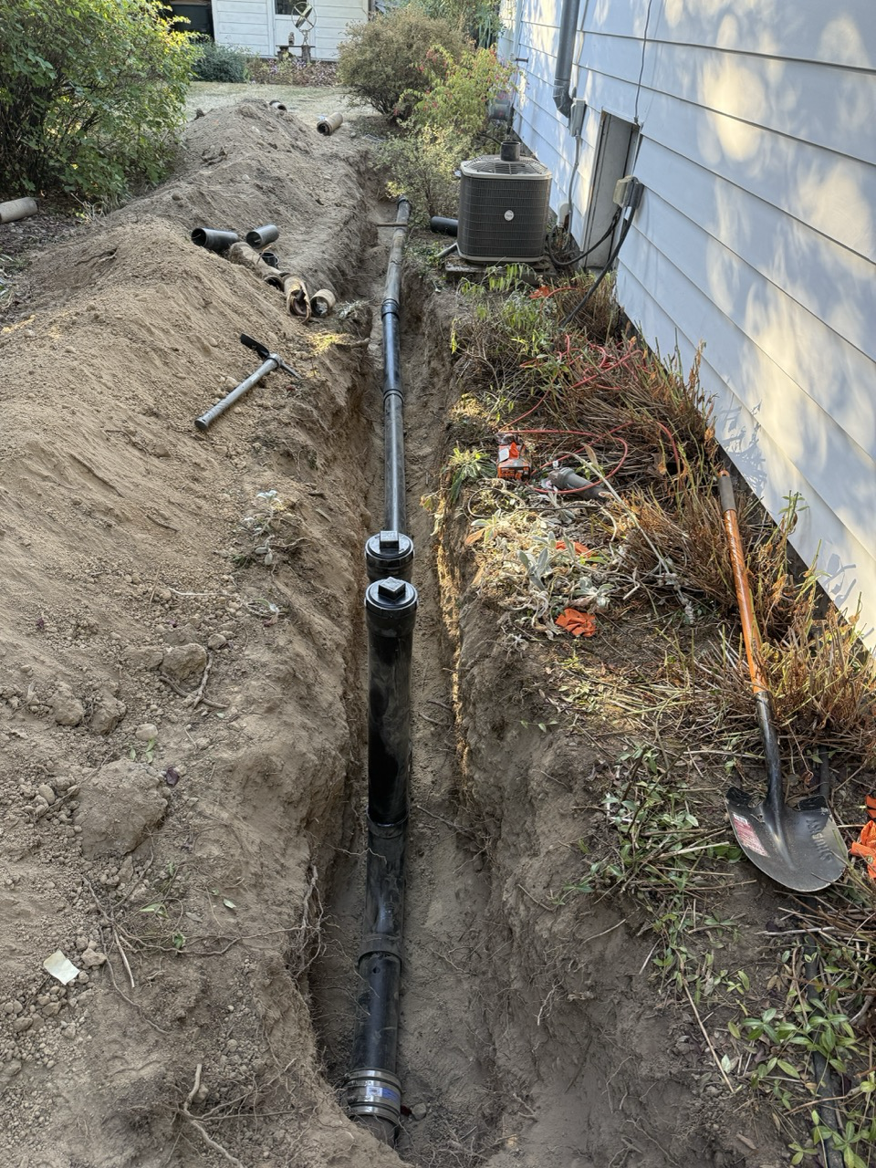 Sewer line replacement in Seattle by Neptune Plumbing after camera inspection found tree root damage and broken clay sewer pipe sections, replaced with durable ABS pipe and two clean outs.

