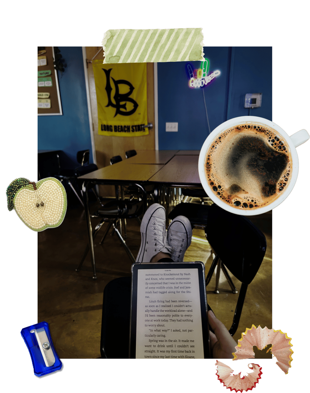 A teacher's desk with coffee and a Kindle