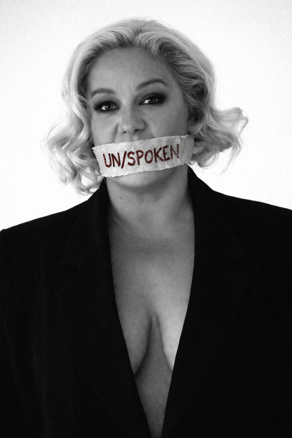 Jade Robertson with UN/SPOKEN tape over her mouth