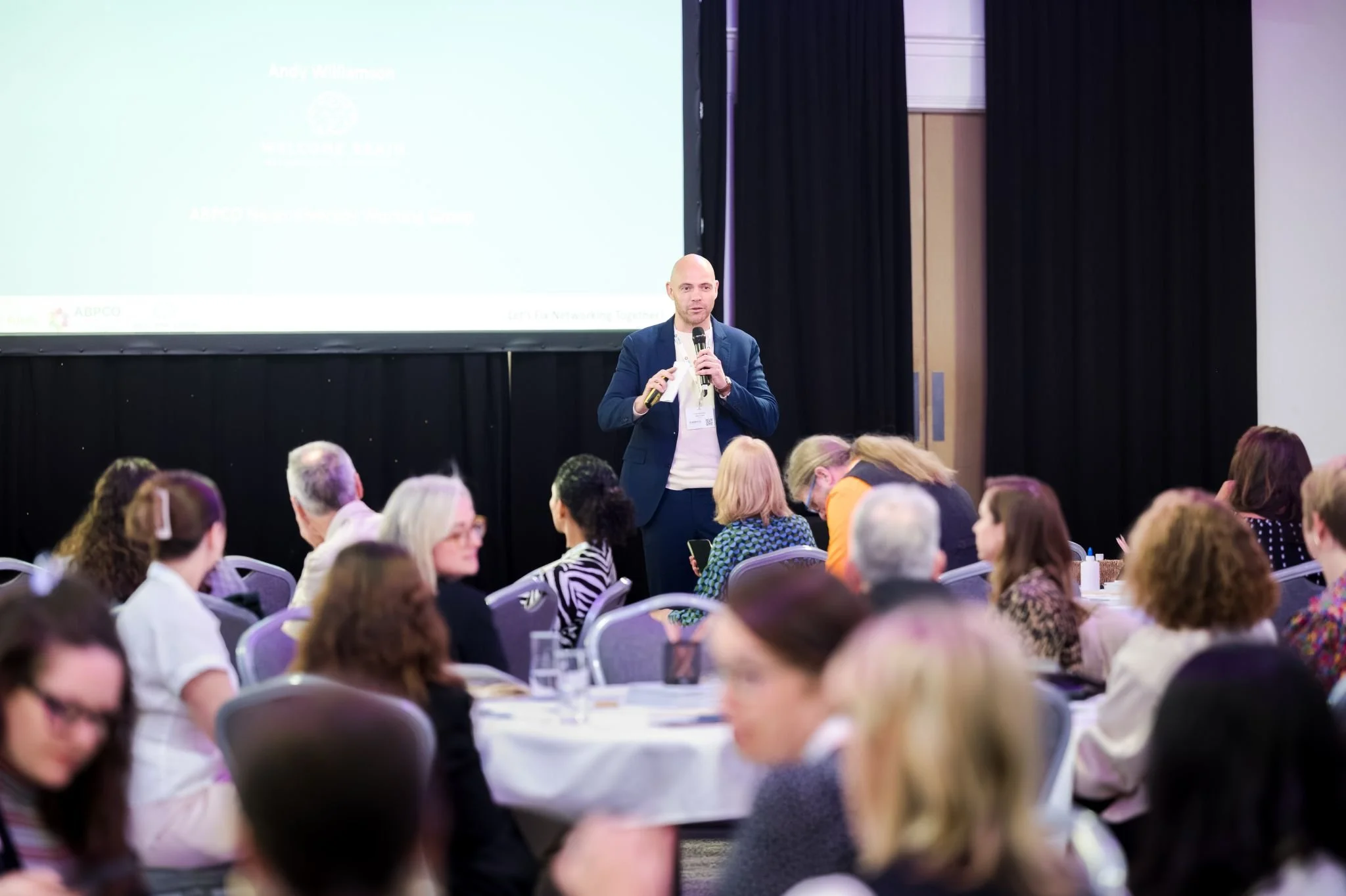 Andy speaking at an event