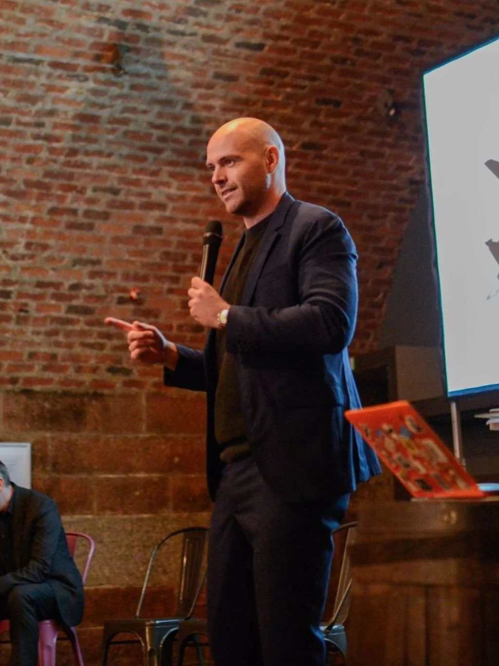 Andy speaking at an event