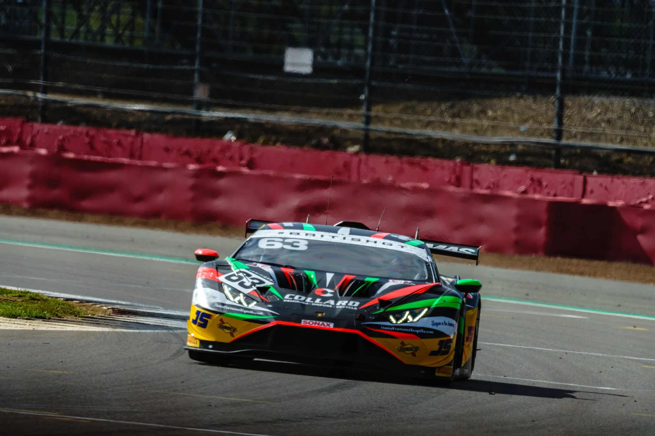 Race car competing on circuit during a race weekend