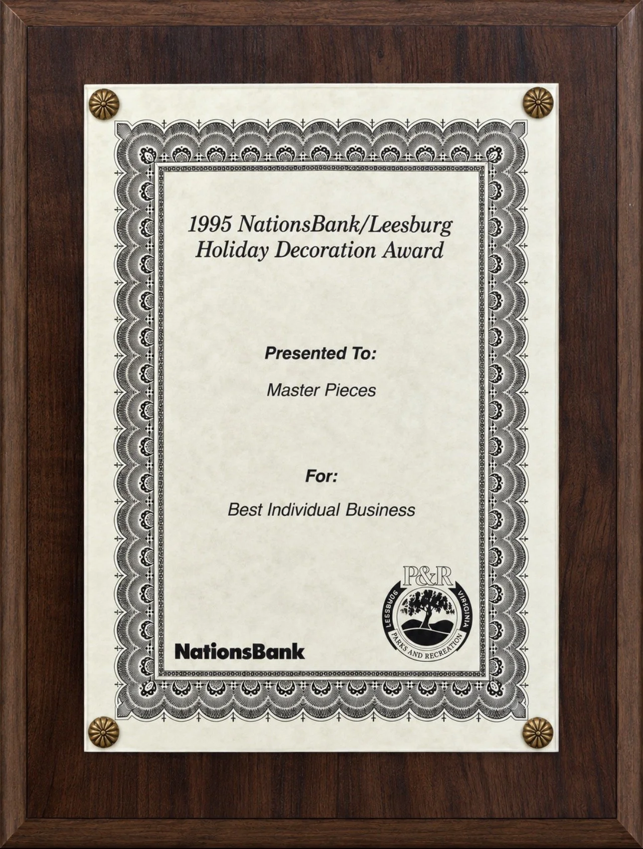 1995 NationsBank/Leesburg Holiday Decoration Award presented to Master Pieces for Best Individual Business.