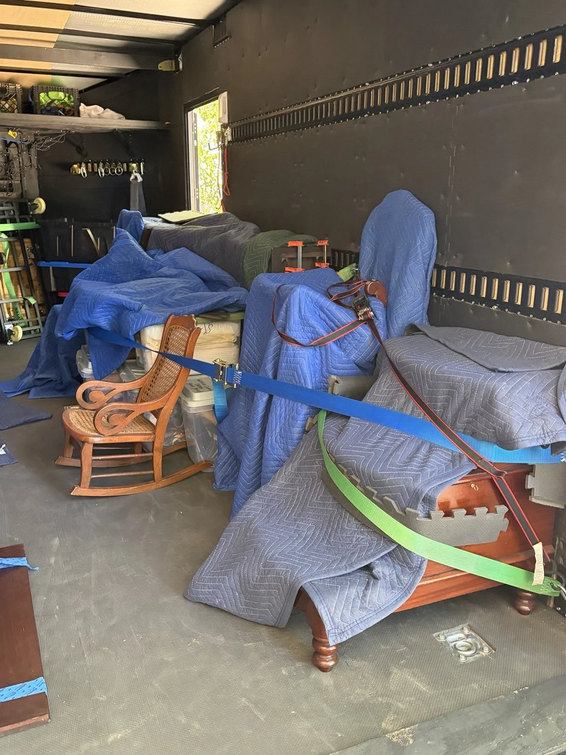Family furniture padded and secured inside Slohaven’s enclosed trailer