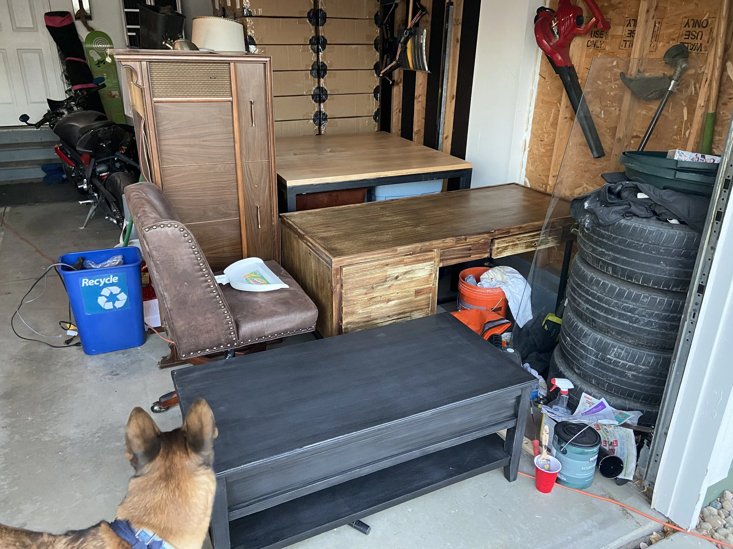 Garage cleanout before photo — furniture, tires, and clutter removal job in Northern NJ