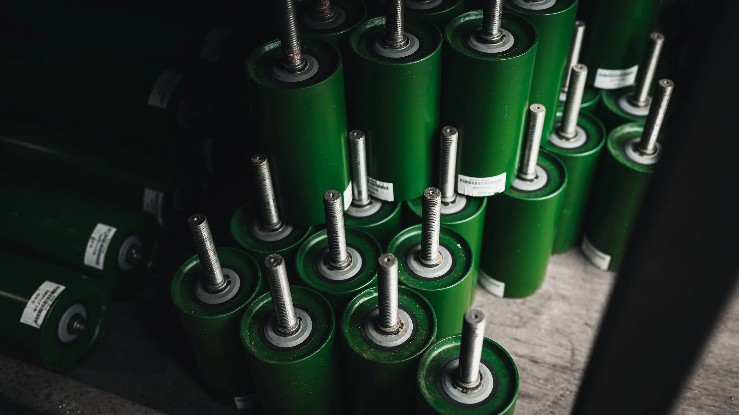 Conveyor roller and frame assembly