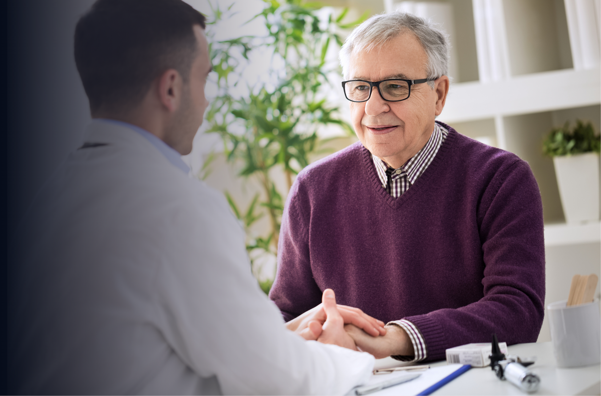 Older man speaking with a healthcare professional
