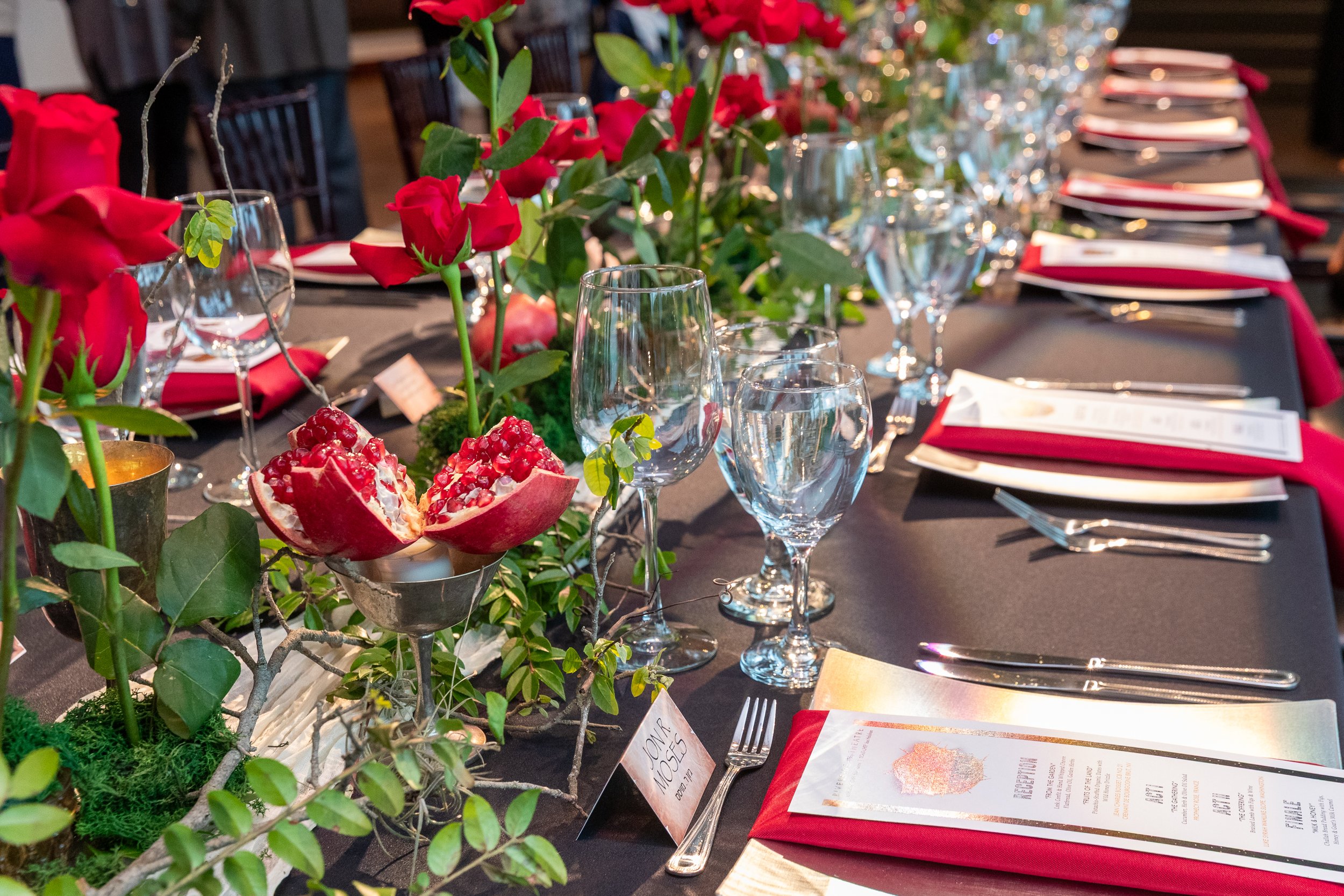 Pre-show fine dining table with red roses and pomegranate, Riverside Theatre, Vero Beach