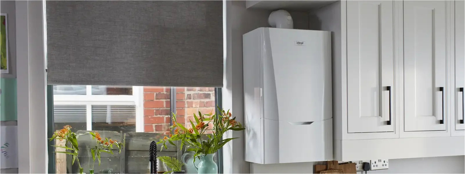 Ideal combi boiler installed in a fitted kitchen alcove