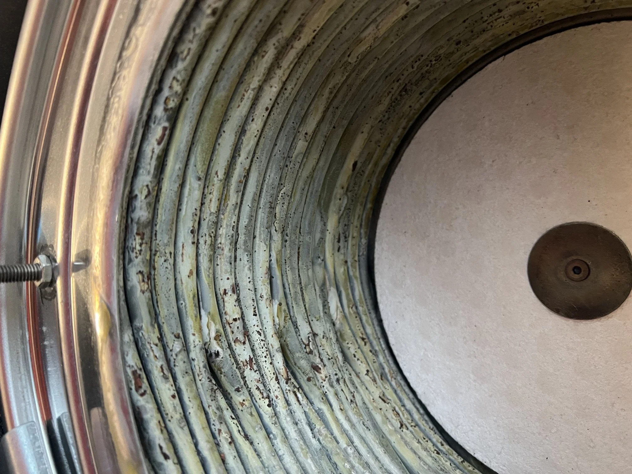 Heat exchanger coils scaled and dirty before cleaning during a boiler service