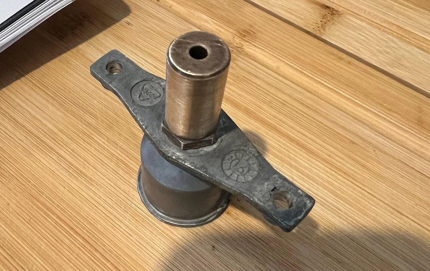 Cleaned gas injector after service work, showing the bright metal jet free of carbon build-up