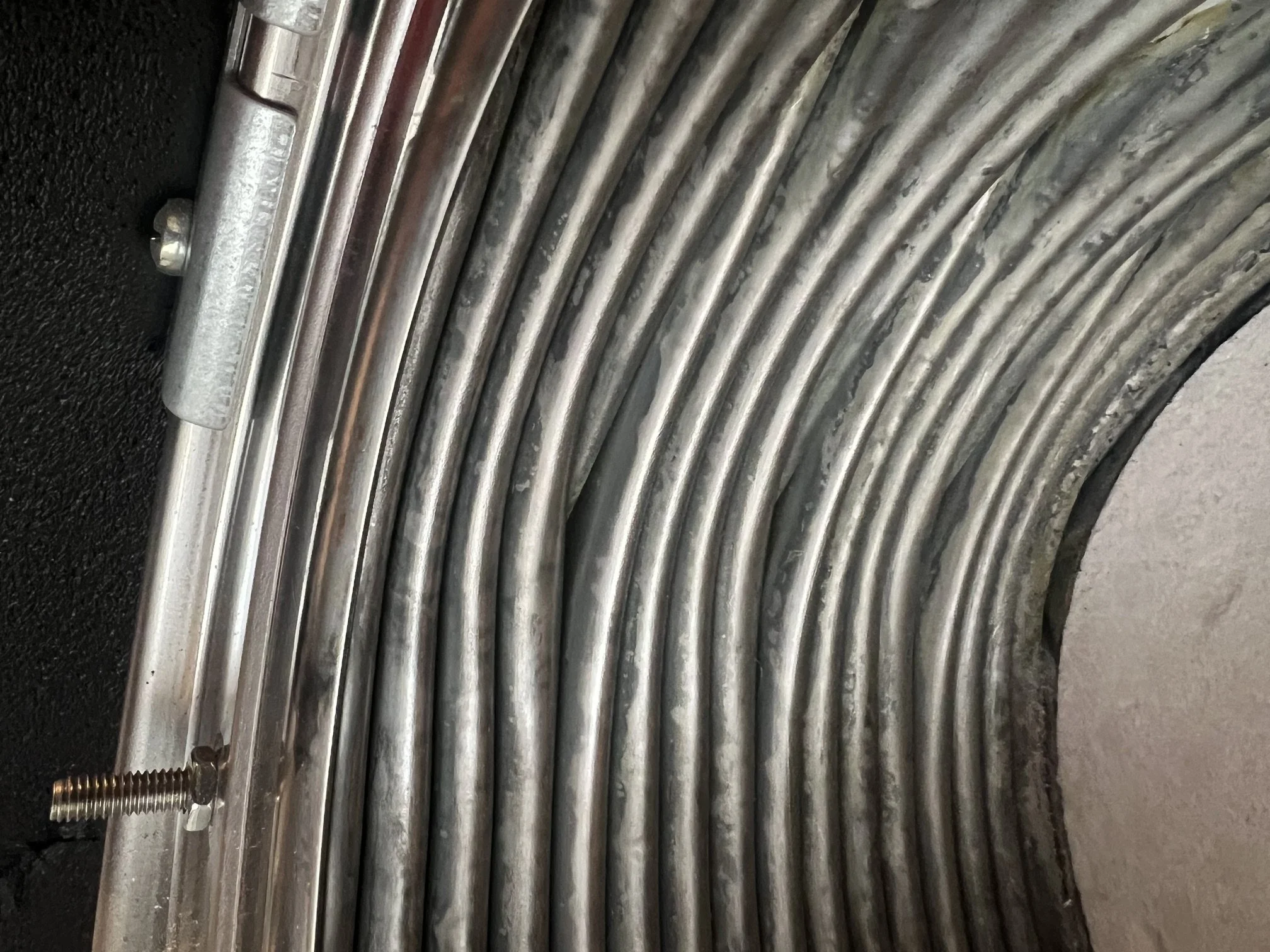 The same heat exchanger coils clean after a strip-down boiler service