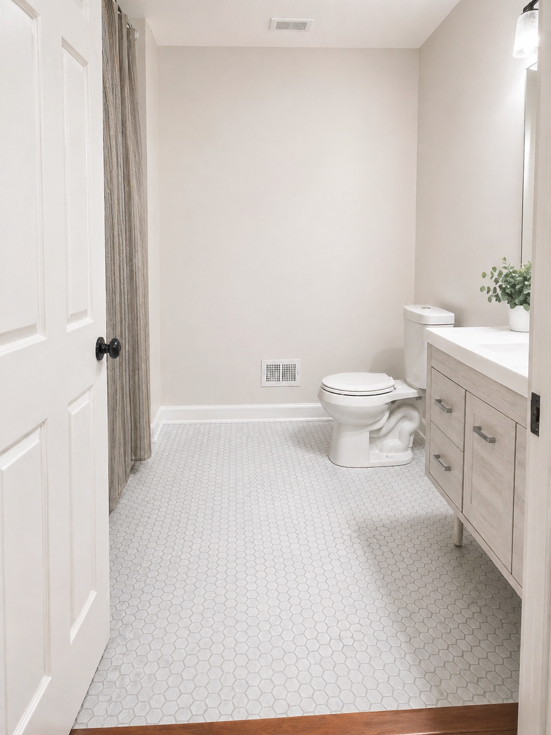 Minimal modern bathroom with soft neutrals by Kaczmarek Contracting