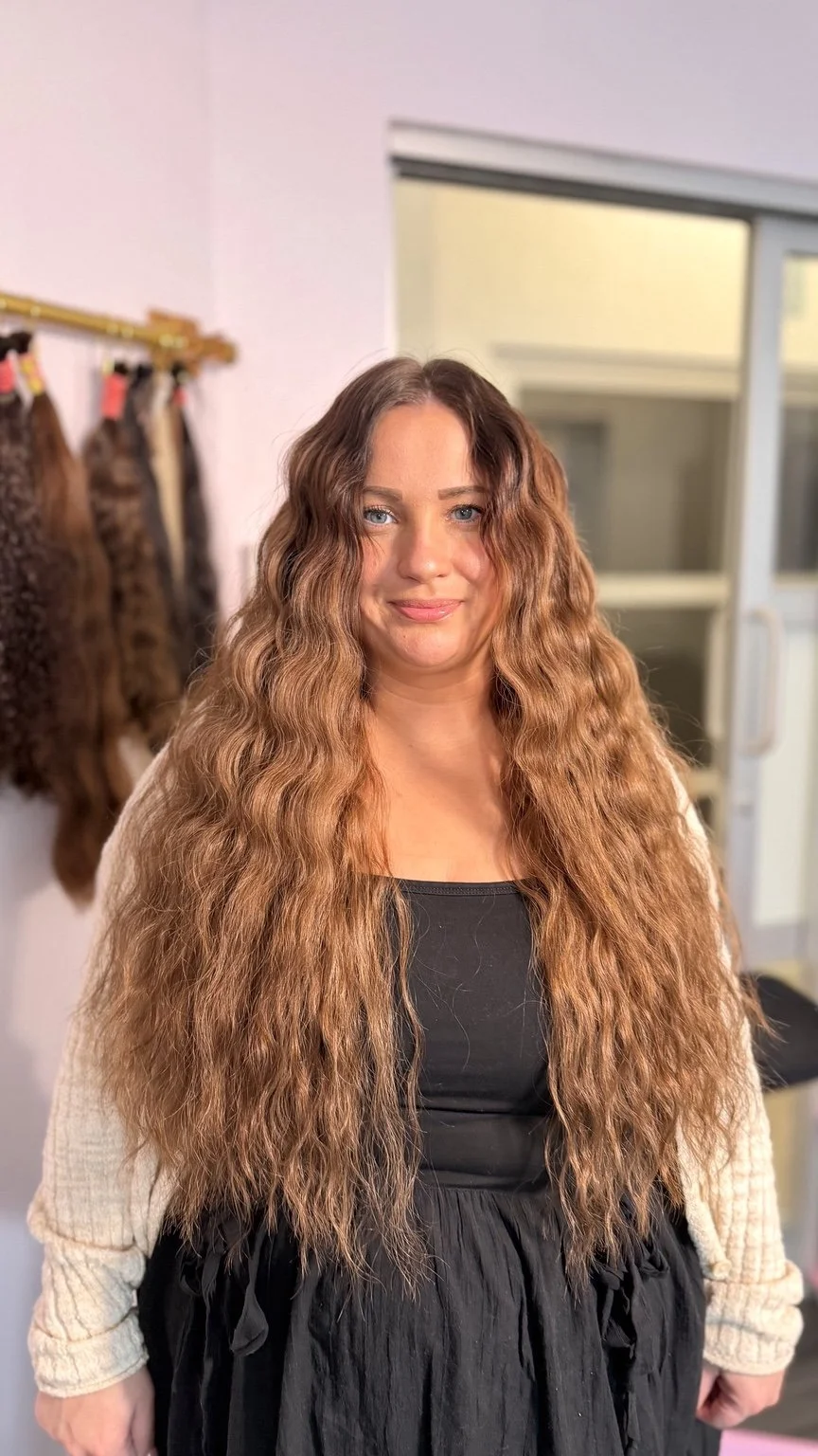 Hairapy client with long warm-copper textured waves