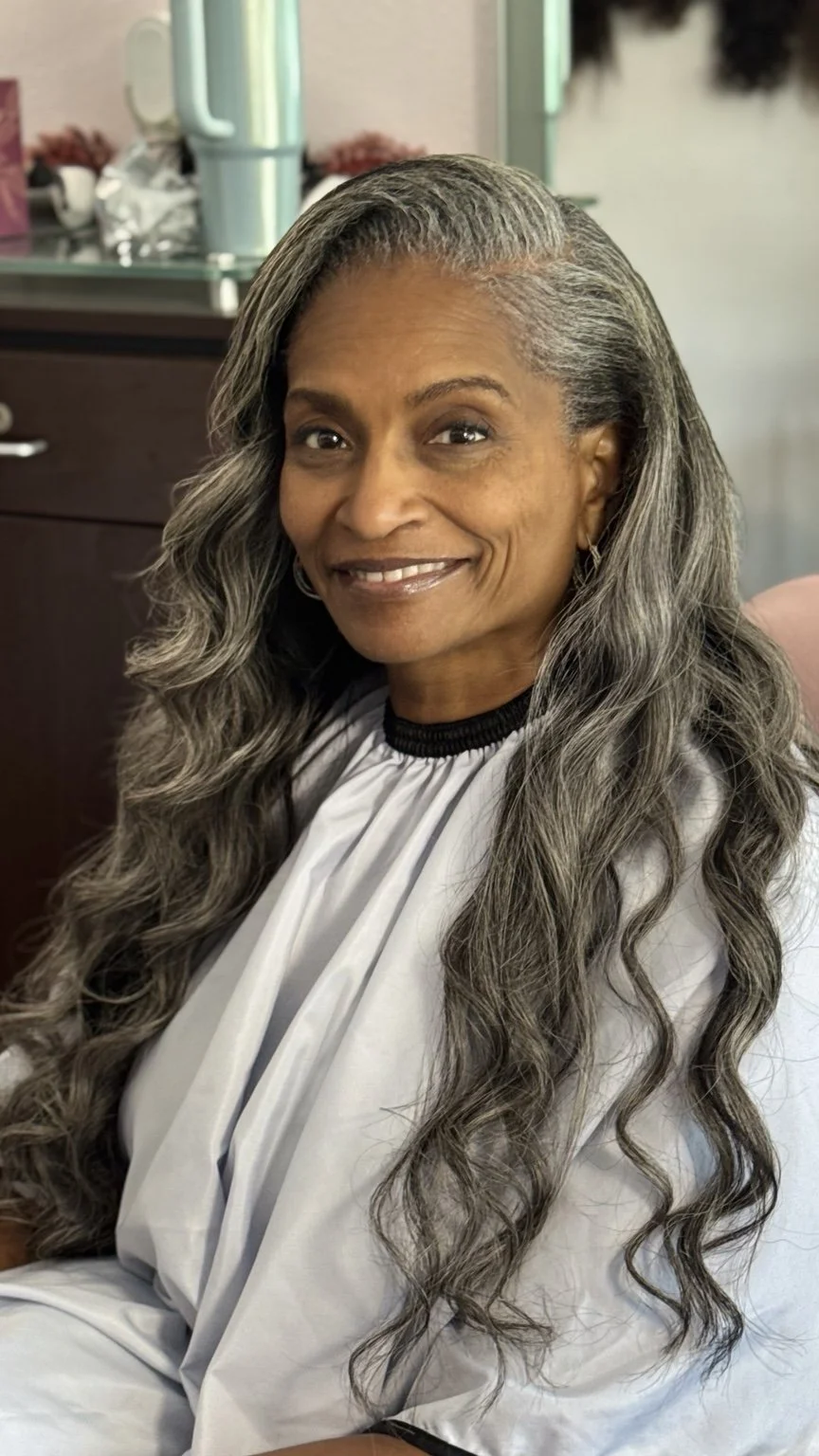 Mature Hairapy client with long salt-and-pepper waves