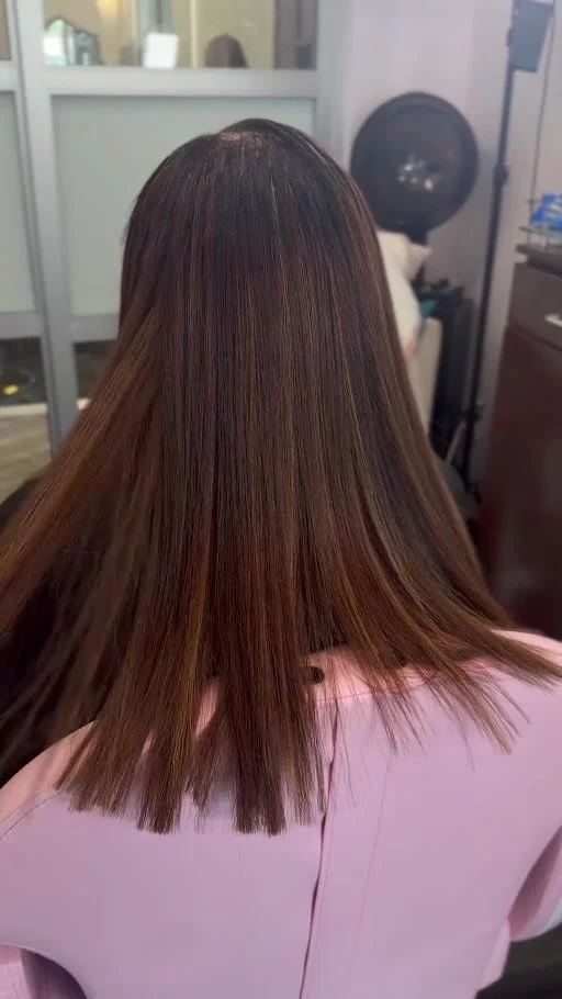 After: the same client with long sleek dimensional hair