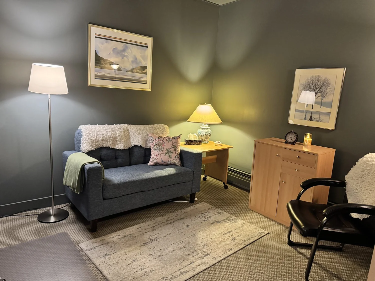 Counselling room with sofa and armchair at Sabrina's Counselling & Wellness, Kelowna