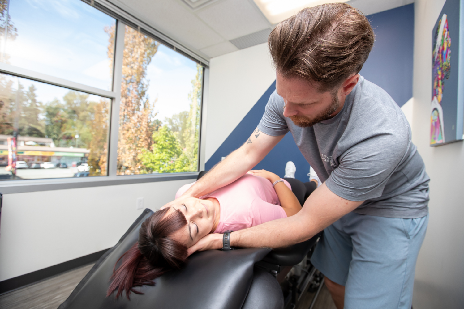 Physiotherapist Colby Treliving performing the Epley manoeuvre with a patient at Station Physiotherapy