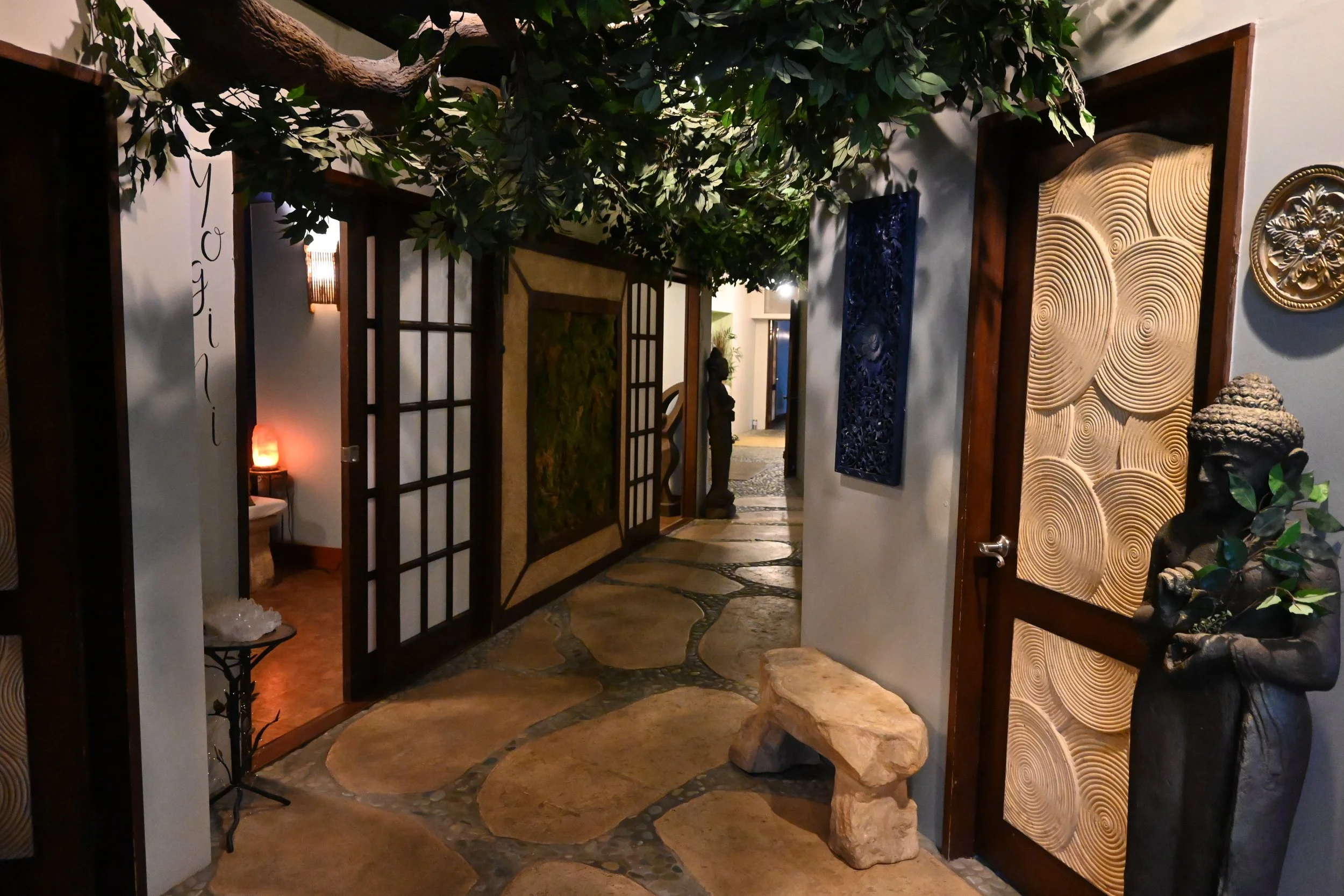 Artwork throughout the hallway at Thrive Yoga