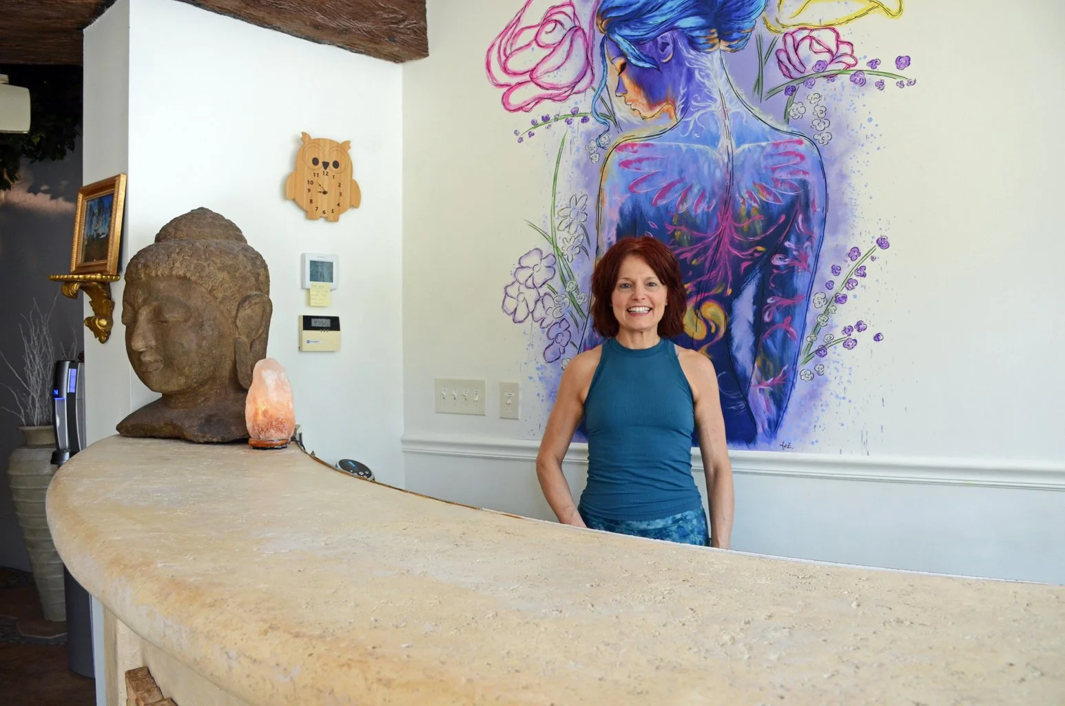 Susan at the Thrive Yoga front desk