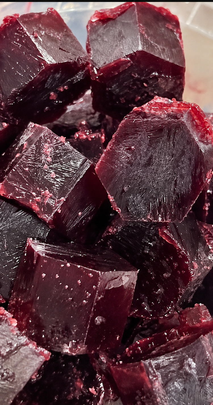 Deep-purple blueberry frozen fruit bites in signature hexagon shapes