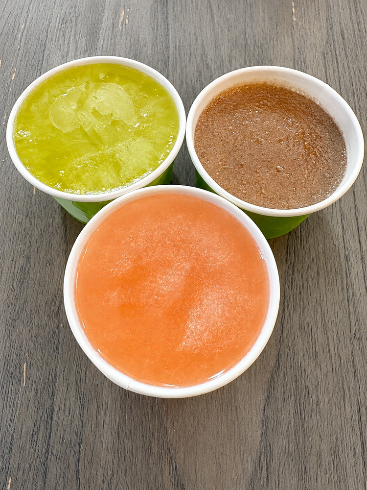 Three colorful Freezy Bitez frozen fruit cups