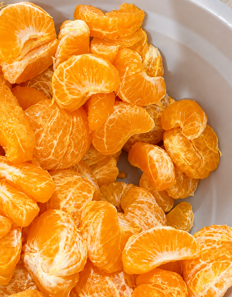 Bright orange citrus segments ready for preparation