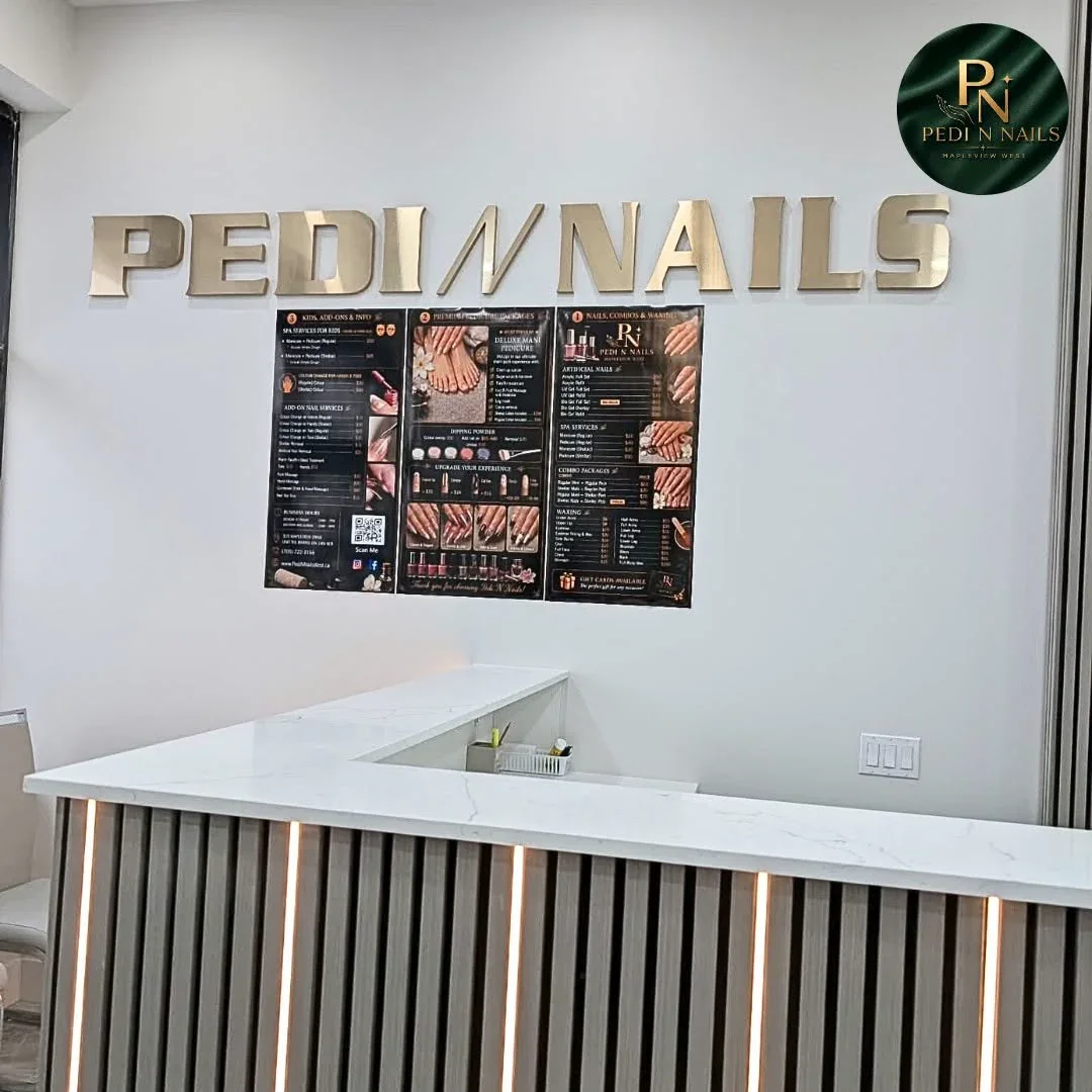 Reception desk and brand wall at Pedi N Nails Mapleview West in Barrie