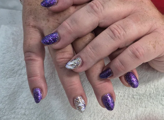 Purple glitter and gold foil accent nails created at Pedi N Nails Mapleview West