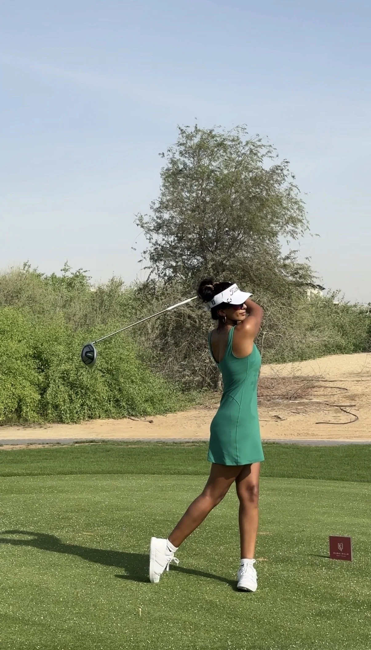 Dr Aarti Patel playing golf in Dubai